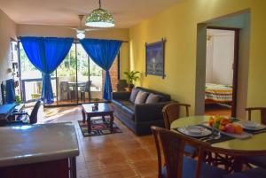 a living room with a couch and a table at Apartment Costambar Puerto Plata in San Felipe de Puerto Plata