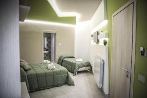 Postel nebo postele na pokoji v ubytování URBAN RELAX