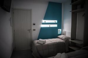 Postel nebo postele na pokoji v ubytování URBAN RELAX