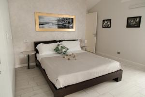 Postel nebo postele na pokoji v ubytování Luxury Apartment Lazise
