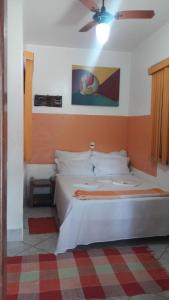 Кровать или кровати в номере Pousada Vila Cintra