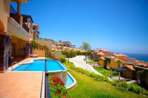 a view of a villa with a swimming pool at Pueblo Bonito Montecristo Luxury Villas - All Inclusive in Cabo San Lucas