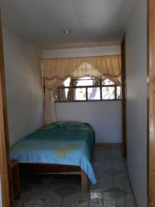 Cama o camas de una habitación en Cabinas Nuestra Kasa