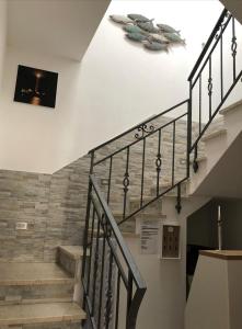 a staircase in a building with a stair case at La Dimora del Passante in San Vito lo Capo