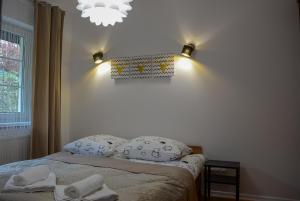 Voodi või voodid majutusasutuse Apartamenty Asturia toas