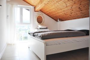 Ένα ή περισσότερα κρεβάτια σε δωμάτιο στο Villa Regina Serafina