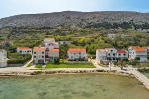 an aerial view of a town with houses at Apartments Rija in Pag
