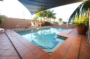 a large swimming pool on a patio with at Comfort Inn Grafton in Grafton