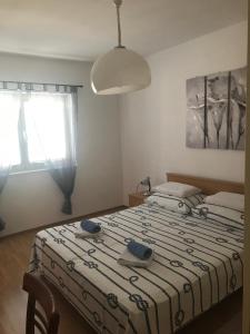 Una cama o camas en una habitación de Apartment Ljilja