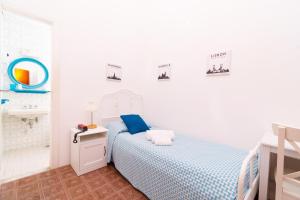 Łóżko lub łóżka w pokoju w obiekcie Villa Panoramica - Ischia Ponte