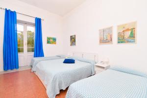 Łóżko lub łóżka w pokoju w obiekcie Villa Panoramica - Ischia Ponte