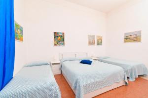 Łóżko lub łóżka w pokoju w obiekcie Villa Panoramica - Ischia Ponte