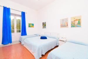 Łóżko lub łóżka w pokoju w obiekcie Villa Panoramica - Ischia Ponte