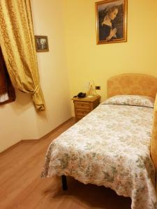 Letto o letti in una camera di Hotel La Rosa
