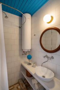 a bathroom with a sink and a mirror at Central, Quiet & Romantic Apartment in Herceg-Novi