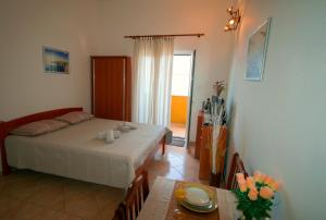 Postel nebo postele na pokoji v ubytování STUDIO APARTMAN STARA BAŠKA
