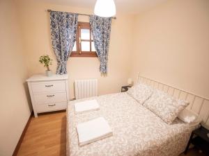 a small bedroom with a bed and a window at Espacios Blanco Plaza del Viejo Coso in Valladolid