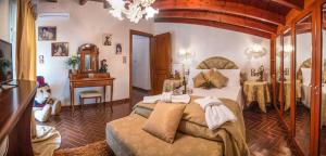a bedroom with a bed and a table and a mirror at Villa Virginia in Vonitsa +96 photos