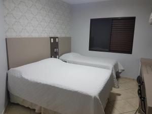 Een bed of bedden in een kamer bij Hotel Nevada