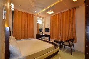 Postel nebo postele na pokoji v ubytování Hotel Central Residency