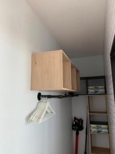 a cabinet hanging on a wall with a tool at LACANAU FRONT DE MER in Lacanau