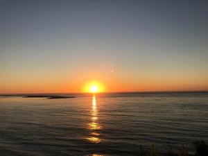 a sunset over a body of water at LACANAU FRONT DE MER in Lacanau