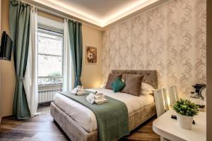 Ein Bett oder Betten in einem Zimmer der Unterkunft Dimore Vespasiano
