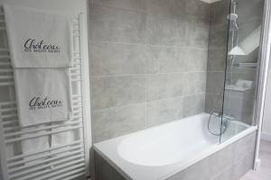 a bathroom with a shower and a tub and a sink at Château des Basses Roches in La Chaussée-Saint-Victor +43 photos