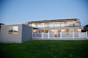 a large house with a lawn in front of it at Scenic Lake View Home in Tacoma