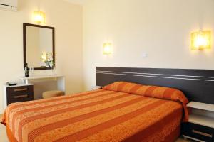 A bed or beds in a room at Hotel Iris