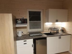 Kuchyňa alebo kuchynka v ubytovaní Domek Pod Gruszą