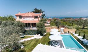 an aerial view of a house with a swimming pool at Fokas Luxury Villa in Prinos