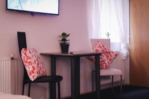 Apartmány Caffe & Grill的电视和/或娱乐中心