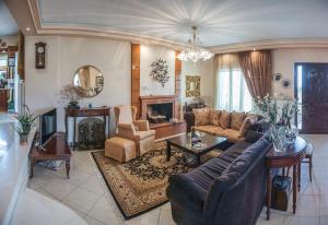 a living room with a couch and a table at Villa Virginia in Vonitsa