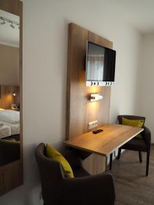 Postel nebo postele na pokoji v ubytování Gasthof Hotel Esterer