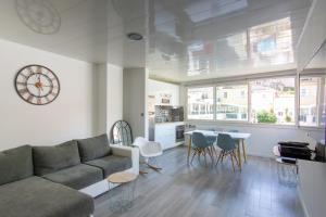 a living room with a couch and a table at La Maisonnette in Marseille