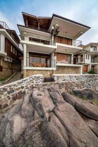 a large rock in front of a house at Sozopol Seaside Villa in Sozopol