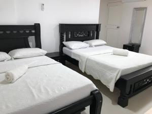 Postel nebo postele na pokoji v ubytování Alojamiento View Jhony Cay