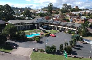 an aerial view of a large building with a pool at Bucketts Way Motel Gloucester in Gloucester