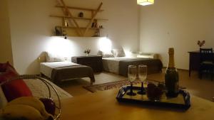 a living room with a table and two wine glasses at Casa Patrikò Chania in Perivólia