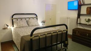Säng eller sängar i ett rum på Casa Patrikò