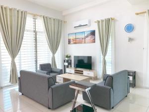a living room with two couches and a tv at Foxi villa Langkawi196 佛系休闲别墅兰卡威196 in Kuah