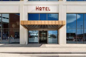 a hotel sign on the front of a building at Best Western Plus Åby Hotel in Mölndal