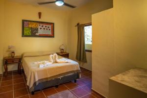 Postel nebo postele na pokoji v ubytování Casa palmito cerca de la playa