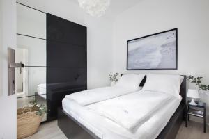 Posteľ alebo postele v izbe v ubytovaní RJ Apartments Chopina