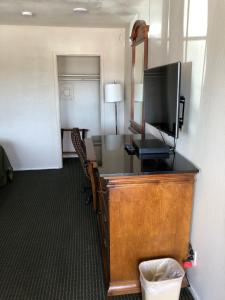 an office with a desk with a television on it at Dixon Motel in Dixon