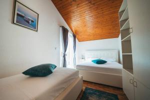 Postel nebo postele na pokoji v ubytování Apartments Juric
