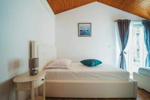 Postel nebo postele na pokoji v ubytování Apartments Juric