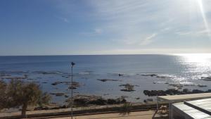 a view of the ocean from a balcony at Casa Barbara in Marzamemi