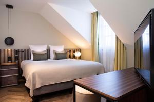 Postel nebo postele na pokoji v ubytování Hotel D Geneva